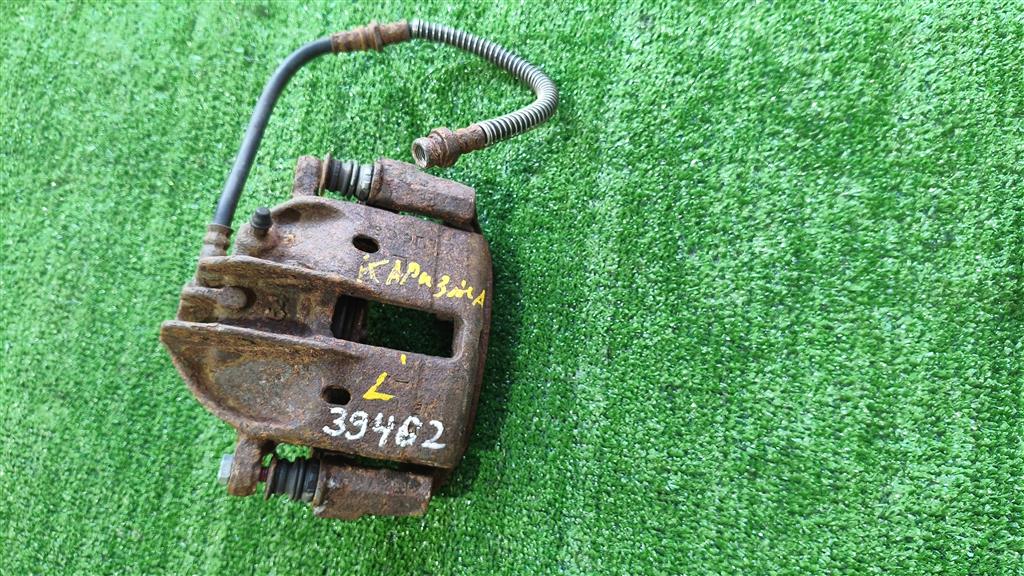 MR863311 Суппорт передний левый